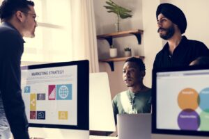 Creative marketing team planning top branding strategies for UAE businesses in 2025